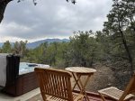 Outdoors, view of the mountains, hot tub and view deck attached to the house